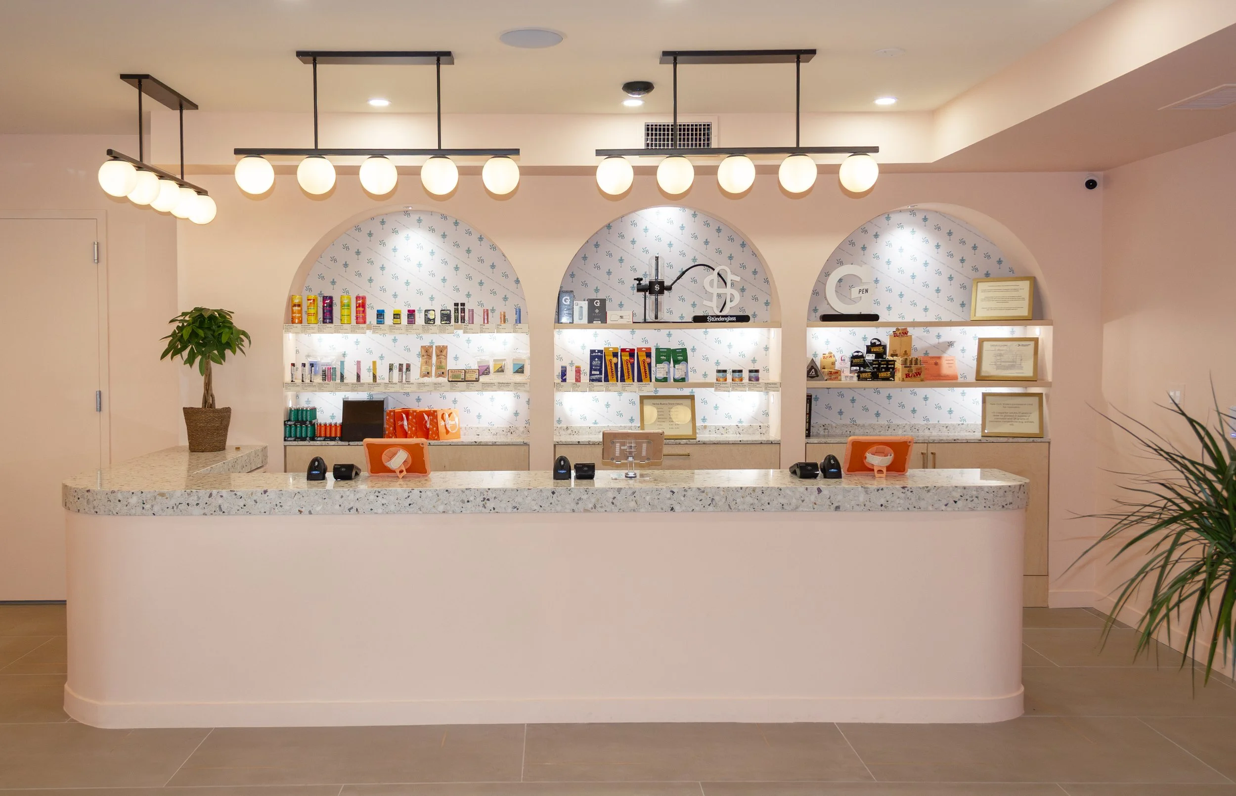 A photograph of the beautiful and warm interior of the Yerba Buena Cobble Hill location, showing Brooklyn's finest point of sale counter with products in view.